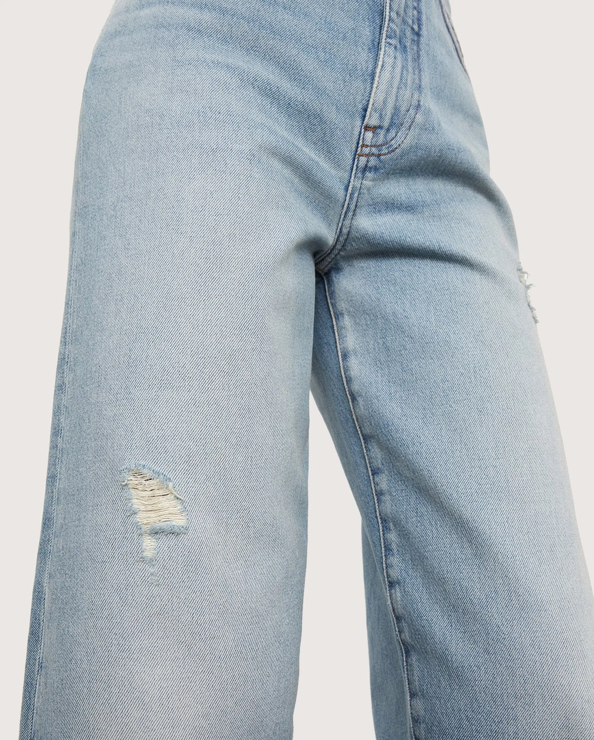 32 Flare Denim in Distressed Light Blue